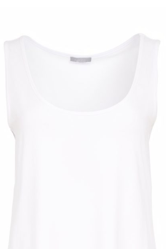 Soft white cami top by Naya with wide straps and a flattering scoop neckline. Easy to layer or wear alone. Shop now at Dotique.
