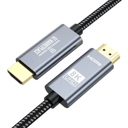 A close up of a usb cable with a black braid