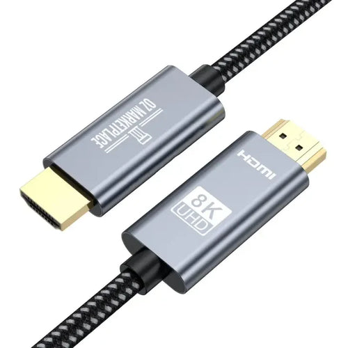 A close up of a usb cable with a black braid