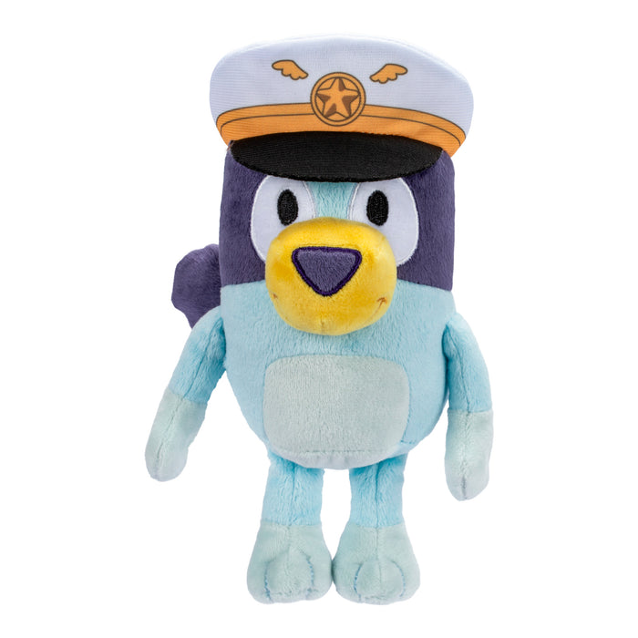 The Bluey & Friends Plushie by Moose Toys is a cuddly blue cartoon dog wearing a white and gold captain’s hat with a star and wings emblem, featuring a yellow nose, dark blue ears, and light blue body—perfect for Bluey fans.