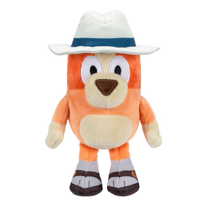 The Bluey & Friends Plushie by Moose Toys features an orange and cream dog with a white hat, blue band, brown shoes, and a friendly face. This upright plush is perfect for fans of Bluey stuffed animals.