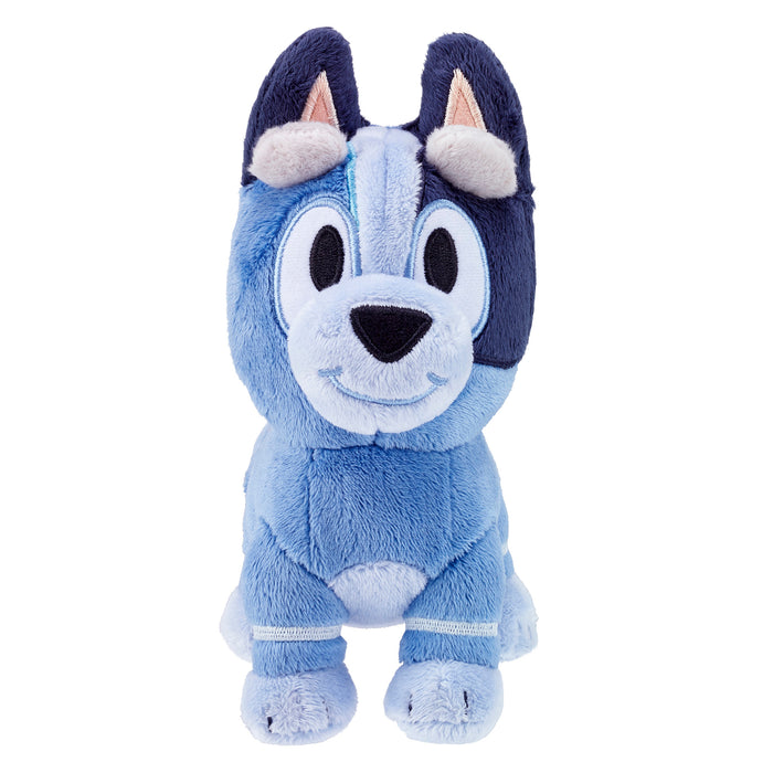 The Bluey & Friends Plushie by Moose Toys is a soft blue cartoon dog with upright ears, a big smile, and expressive eyes, featuring light and dark blue patches—perfect for fans of Bluey.