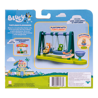 The image shows the back of a Moose Toys Bluey Mini Playset & Figures package, featuring the Turtleboy Playground with Bingo and Turtleboy on a swing, highlights of play features, collectible sets, and a colorful house at the bottom.
