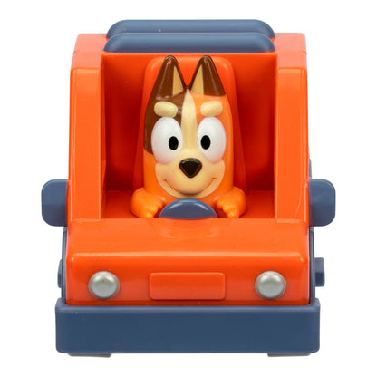 The Moose Toys Bluey Mini Racers collectible features a smiling cartoon dog with brown ears driving an orange and blue car, viewed from the front with the dog holding the steering wheel.