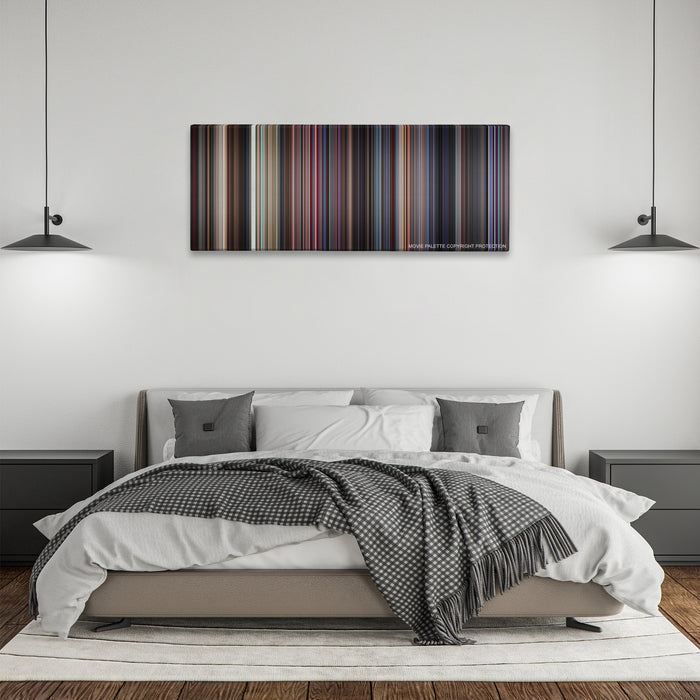 Boogie Nights color palette canvas above a bed, between two black pendant lamps