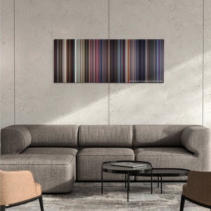 Boogie Nights color palette canvas on a concrete wall above a gray sectional sofa