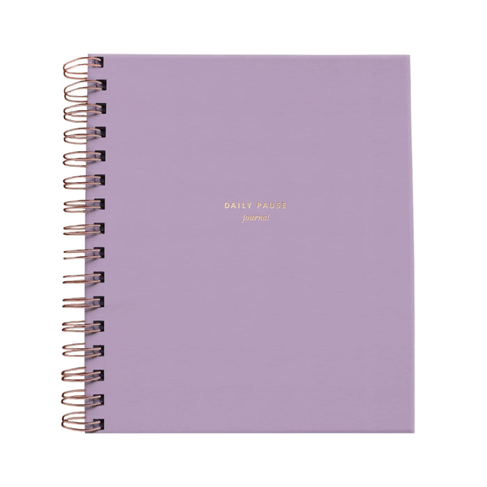 Purple notebook with gold text on a white background