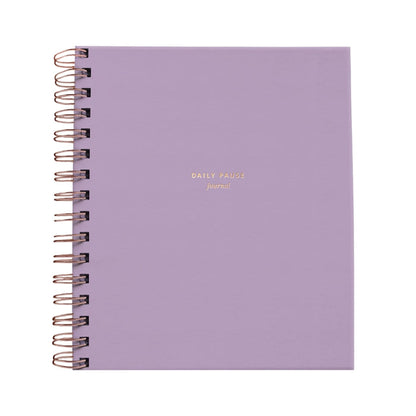 Purple notebook with gold text on a white background