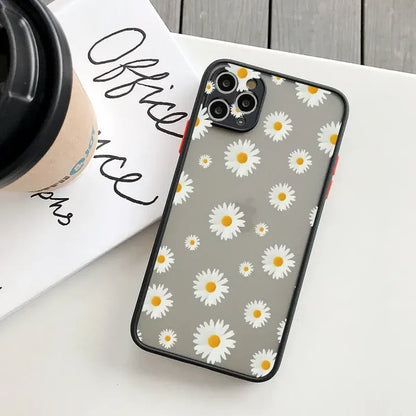 Daisy iphone case with a coffee cup on a table