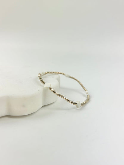 eGirl Signature Cross Small Pattern 2mm Bracelet - Off White Bracelets in at Wrapsody