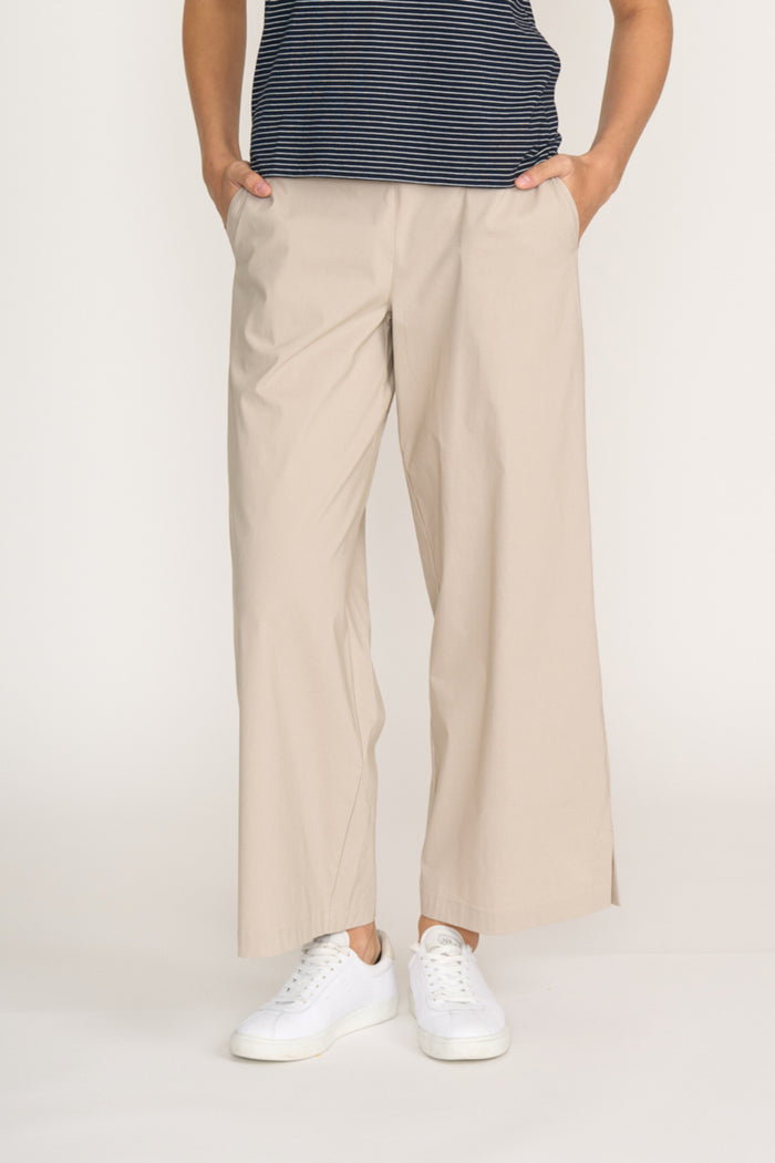 Front view of model wearing Foil Fo8259 Broad Horizon Trousers Sand paired with casual sneakers Shop Foil at Dotique