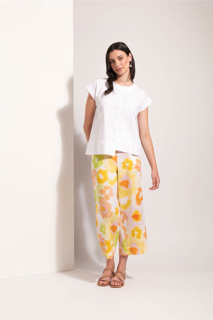 Model wearing Foil Fo8341 Cut Of Your Rib Top White by Foil paired with floral pants, shop Foil at Dotique.