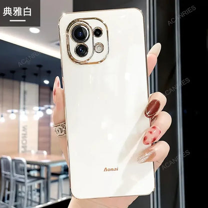 a woman holding a white phone case