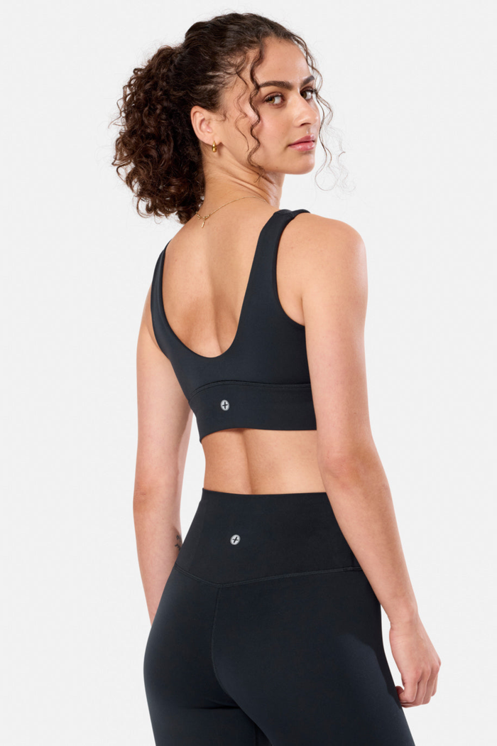 Woman wearing Gym + Coffee Soft-Motion Bra Black by Gym+Coffee, shop the vendor at Dotique for activewear styles.