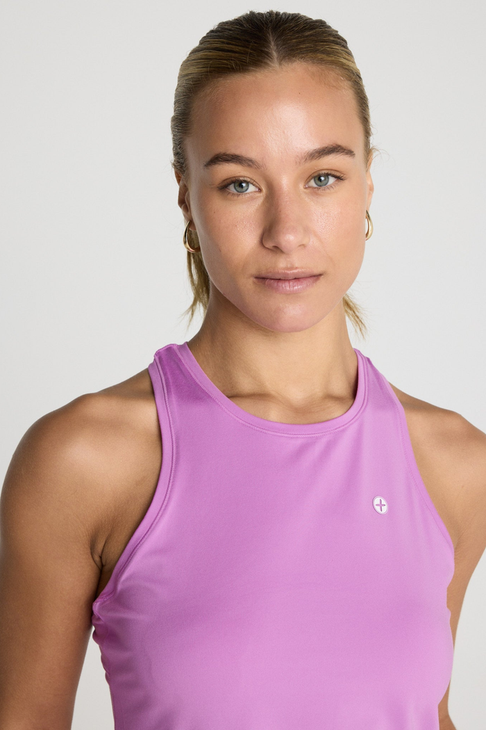Woman wearing Gym+Coffee Relentless Racer Back Vest Neon Pink by Gym+Coffee, shop the Gym+Coffee range at Dotique.