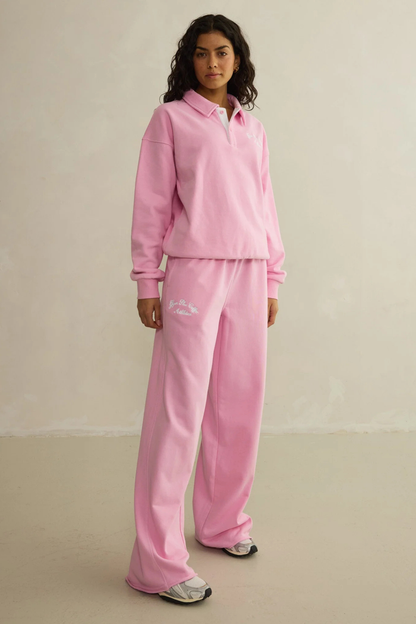 Model wearing Gym+Coffee Urban Wide Leg Jogger in Pink Blossom by gym+coffee, shop gym+coffee at Dotique