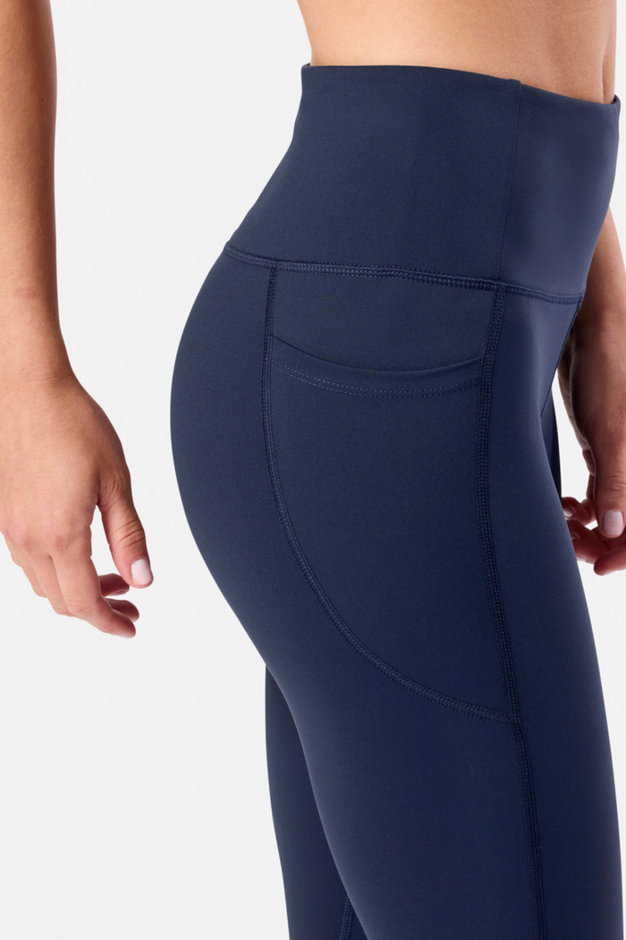 Gym+Coffee Womens Relentless Legging 7/8 Twilight Navy shown with side pocket, shop Gym+Coffee at Dotique for activewear benefits