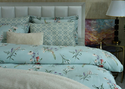 Ice blue comforter and pillows with botanical floral pattern