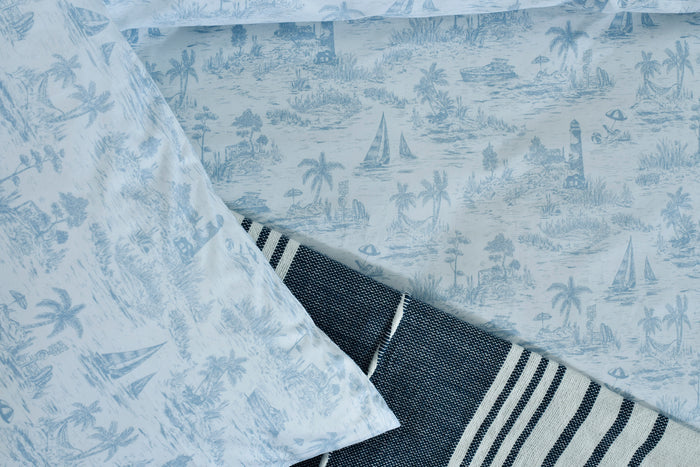 Nautica printed duvet cover corner with light blue fabric and navy-and-white striped trim