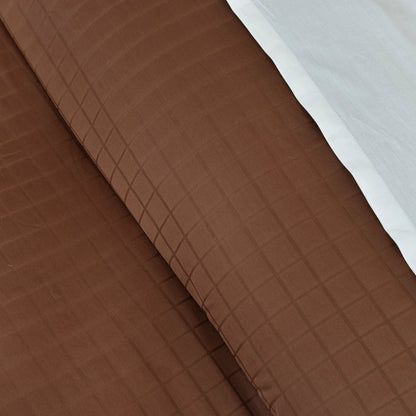 Brown quilted duvet cover with diamond grid stitching
