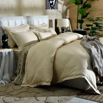 Beige cotton satin duvet cover with quilted pillows and soft pleated bedding