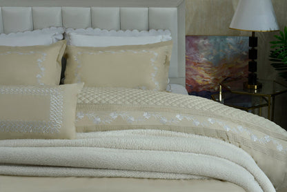 Sand duvet cover set with embroidered pillow shams and quilted duvet panel