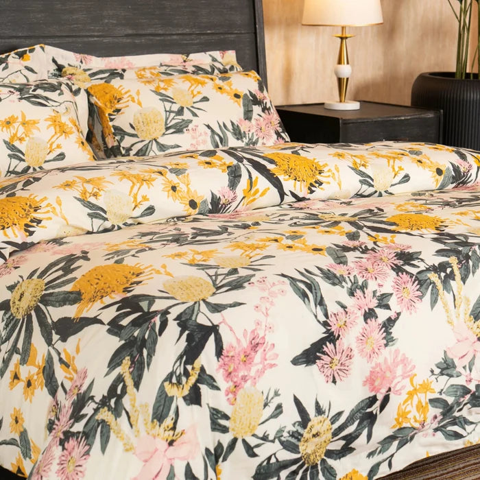 Floral bed set with cream duvet and pillowcases, yellow flower heads and pink blossoms