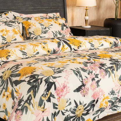 Floral bed set with cream duvet and pillowcases, yellow flower heads and pink blossoms
