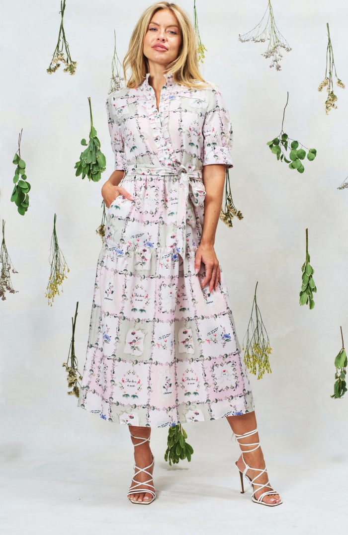 Woman wearing Hope & Ivy Pamela Tiered Maxi Dress in floral print, shop Hope and Ivy at Dotique for elegant style.