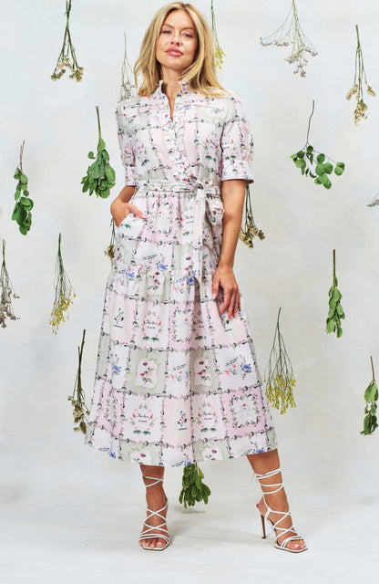 Woman wearing Hope & Ivy Pamela Tiered Maxi Dress in floral print, shop Hope and Ivy at Dotique for elegant style.