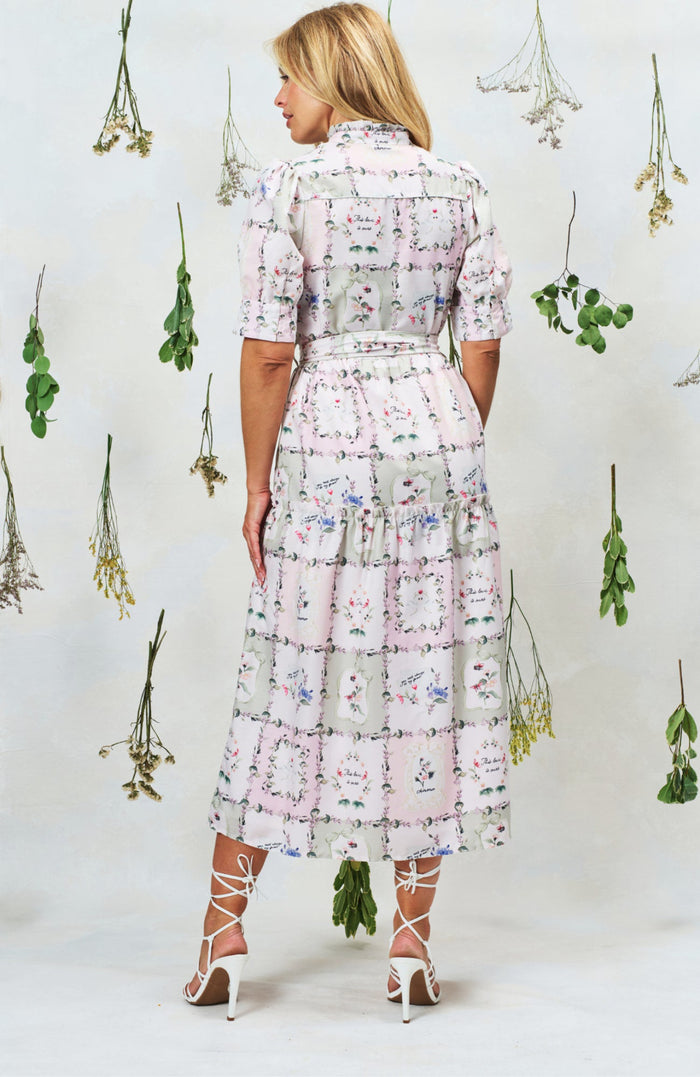 Back view of Hope & Ivy Pamela Tiered Maxi Dress in floral print, shop Hope and Ivy at Dotique for elegant style.