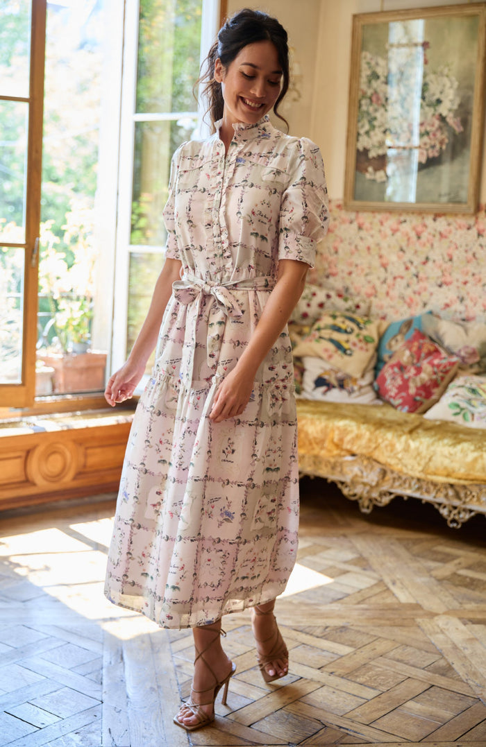 Woman wearing Hope & Ivy Pamela Tiered Maxi Dress with floral print, available to shop the Hope and Ivy collection at Dotique