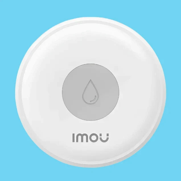 A close up of a button with a water drop on it