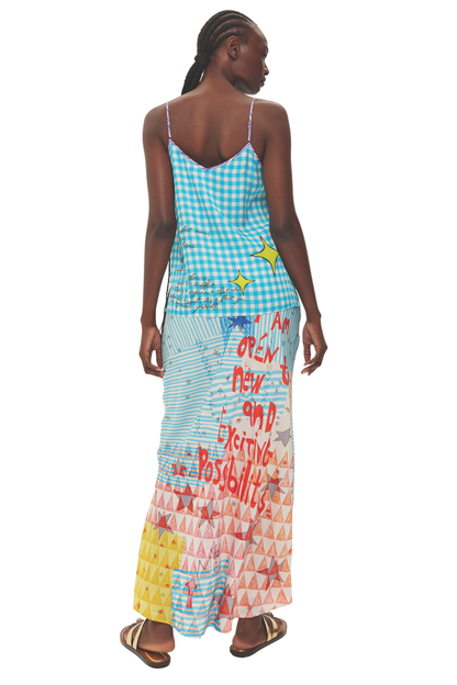 Model wearing Me369 Blakely Runic Whisper Slip Skirt by Me369 with bold red lettering, shop Me369 at Dotique