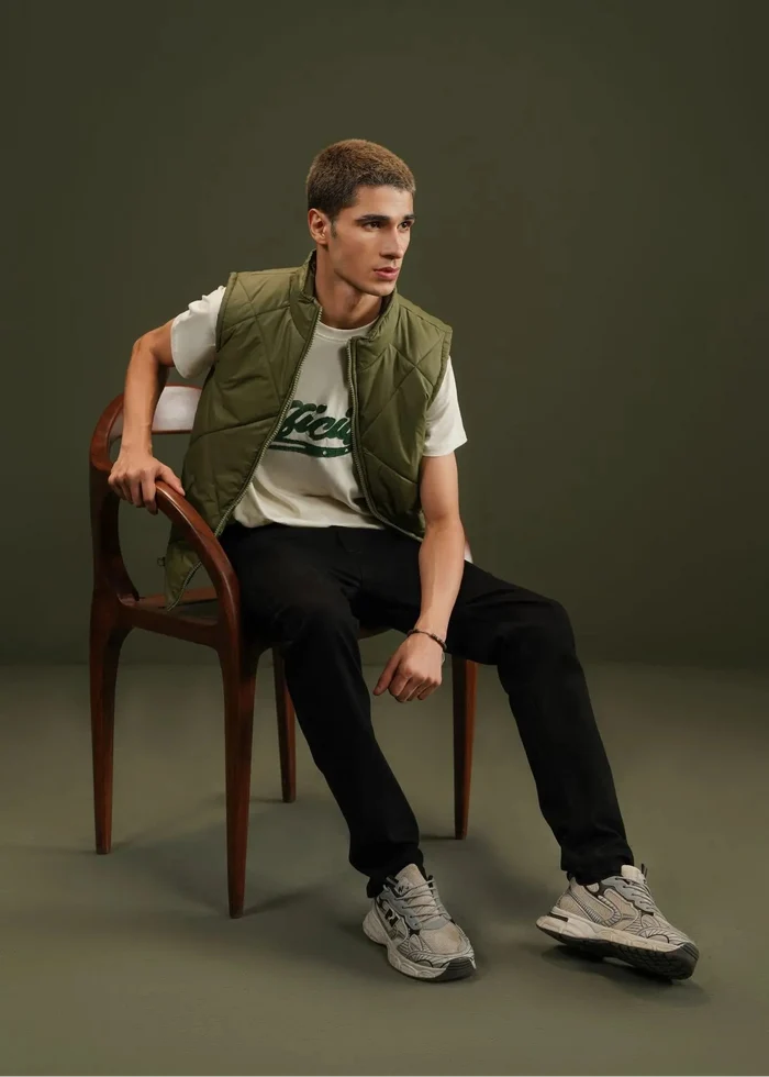 Men's olive quilted bubble vest with diamond quilting and zip front