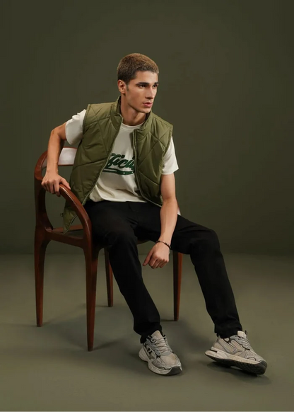Men's olive quilted bubble vest with diamond quilting and zip front