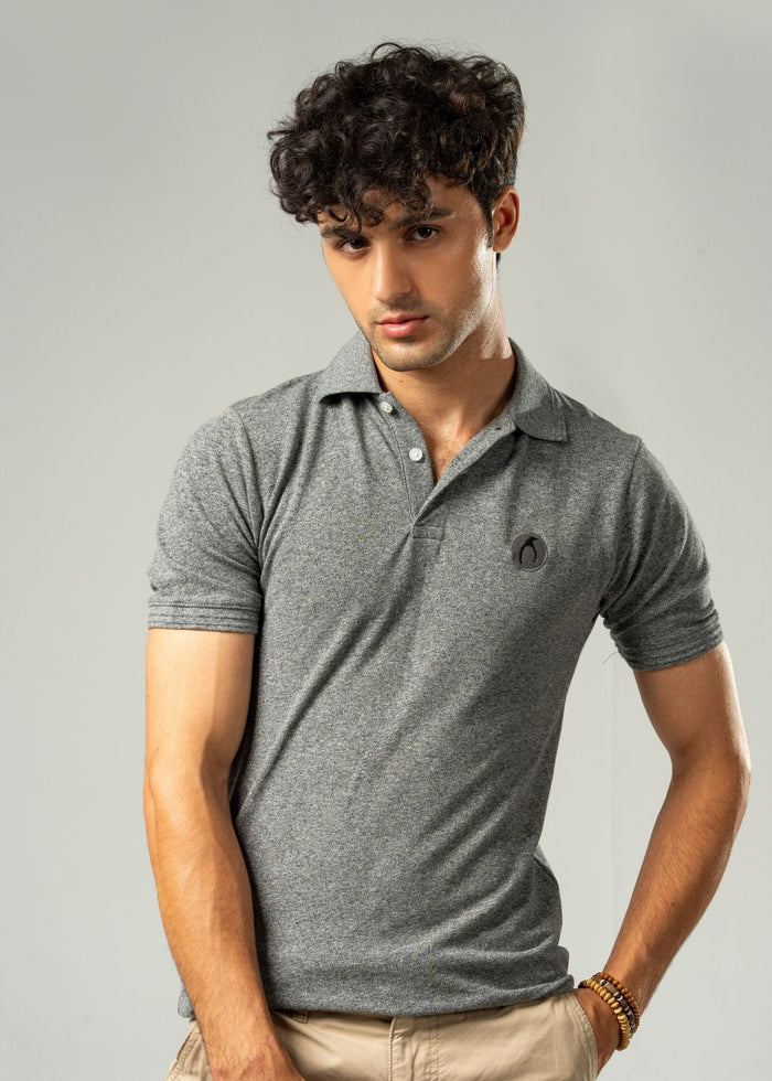 Men's grey polo shirt with short sleeves, fold-over collar, chest logo patch