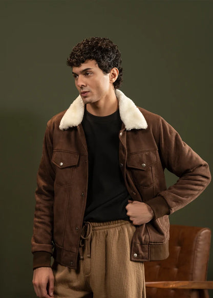 Men's brown suede jacket with sherpa collar, chest pockets, and snap buttons