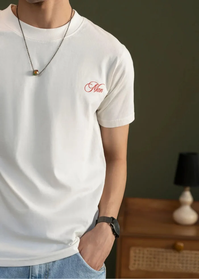 Off-white crew-neck cotton T-shirt with small red logo on the left chest