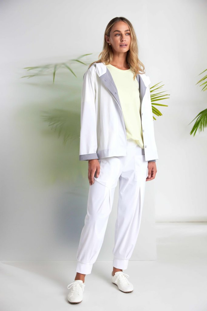 Soft lemon yellow Naya jersey top with a relaxed fit and cut-out hem detail. Easy to wear and perfect for everyday. Shop at Dotique.
