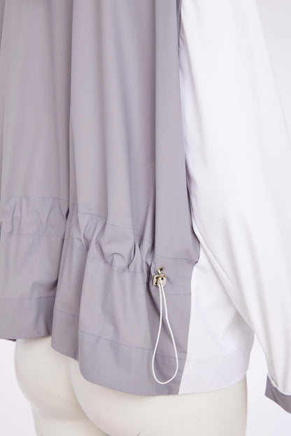 Close-up of the adjustable hem detail on Naya NAS26180 Hooded Contrast Back Jacket with Patch Pocket in White & Grey by Naya shop at Dotique