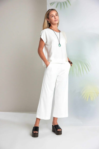 Model wearing Naya NAS26237 White Wide Leg Pull-On Trousers by Naya, shop Naya at Dotique for stylish essentials.