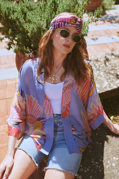 Crane Periwinkle kimono by One Hundred Stars in a premium modal-cupro blend. Lightweight, fluid and perfect for layering over dresses or tops. Shop at Dotique.