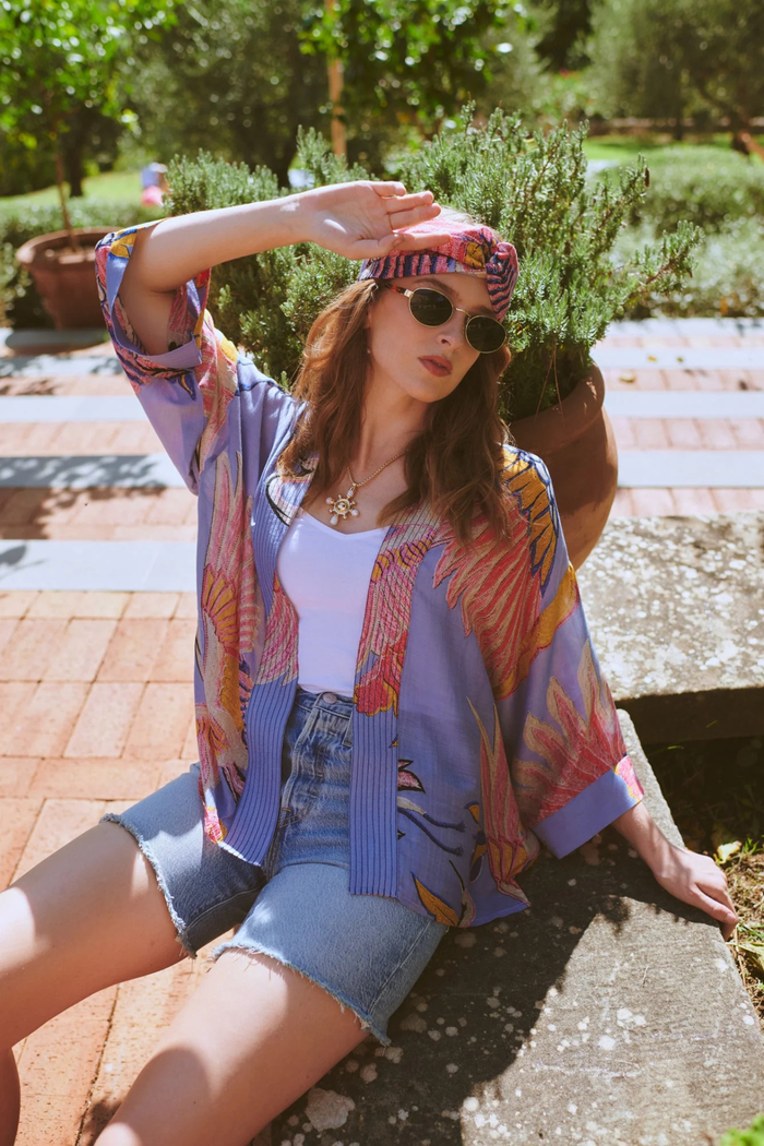 Crane Periwinkle kimono by One Hundred Stars in a premium modal-cupro blend. Lightweight, fluid and perfect for layering over dresses or tops. Shop at Dotique.