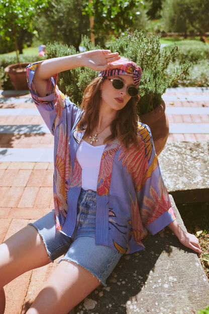 Crane Periwinkle kimono by One Hundred Stars in a premium modal-cupro blend. Lightweight, fluid and perfect for layering over dresses or tops. Shop at Dotique.