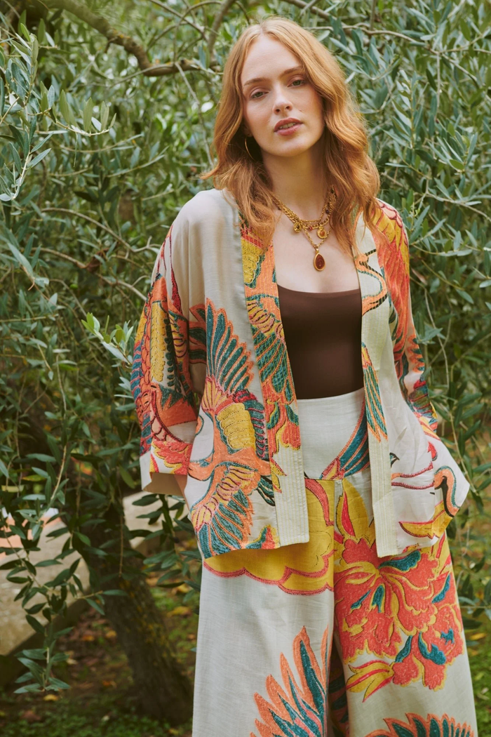 Crane Stone kimono by One Hundred Stars in a premium modal-cupro blend. Lightweight, fluid and perfect for layering over dresses or tops. Shop at Dotique.