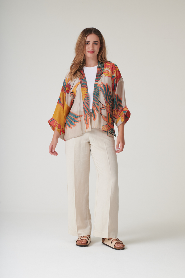 Crane Stone kimono by One Hundred Stars in a premium modal-cupro blend. Lightweight, fluid and perfect for layering over dresses or tops. Shop at Dotique.