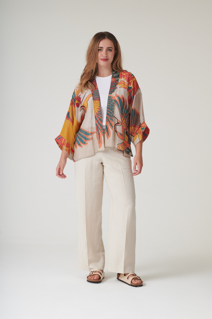 Crane Stone kimono by One Hundred Stars in a premium modal-cupro blend. Lightweight, fluid and perfect for layering over dresses or tops. Shop at Dotique.
