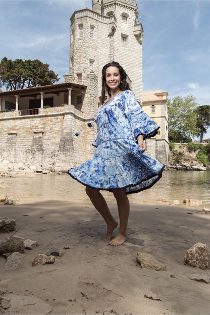 Smiling woman barefoot on sand wearing Orientique 40188 Okayama Dress Layers Frill Sleeve Print by orientique, shop orientique at Dotique