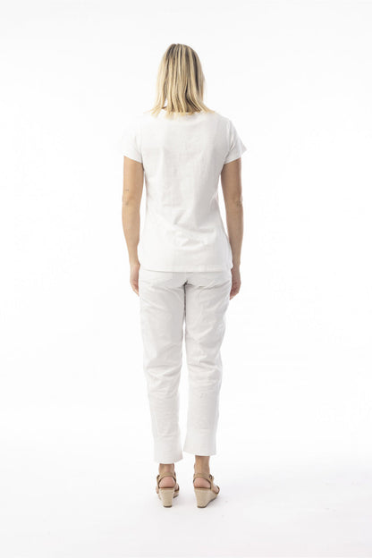 Model showing back view of Orientique 92129 Knit Essentials V-neck Tee White by orientique, shop orientique at Dotique